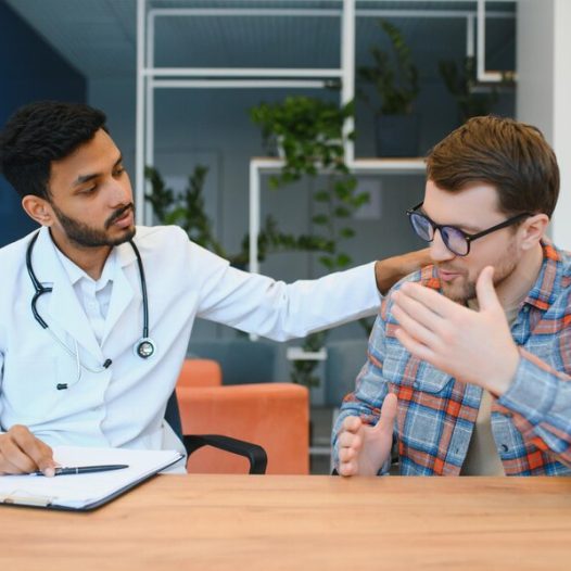 medicine-healthcare-people-concept-indian-doctor-giving-prescription-male-patient-clinic_255667-52432